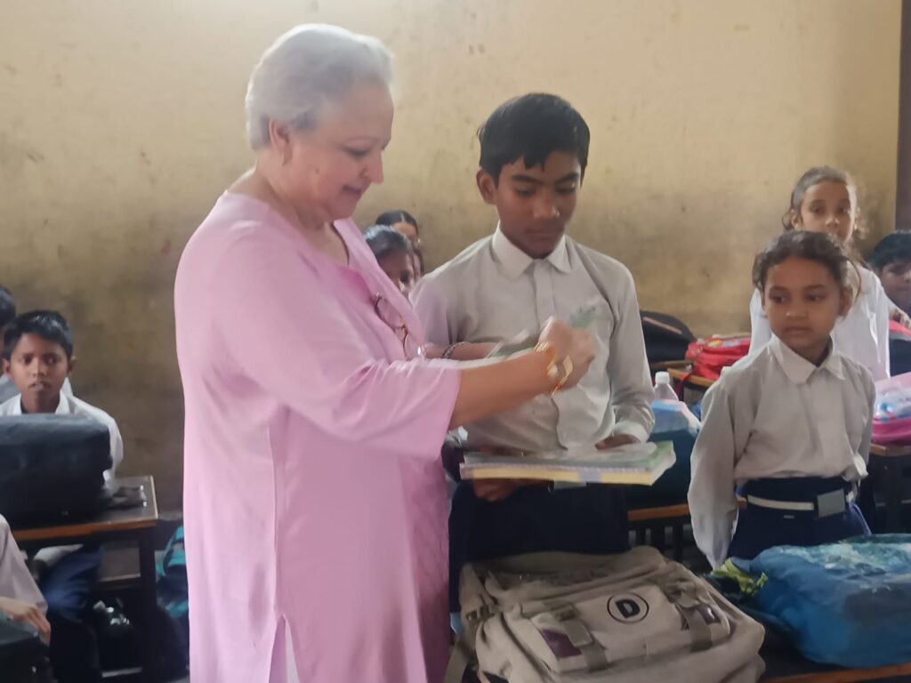 TVBT classroom support moment with students receiving learning materials